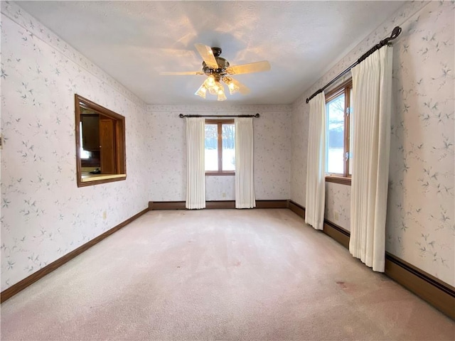 3240 E Lake Rd, Shenango, PA 16134 - spare room featuring a baseboard radiator, light carpet, and ceiling fan