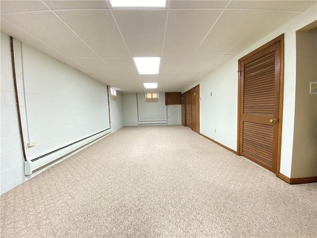 3240 E Lake Rd, Shenango, PA 16134 - finished below grade area with a baseboard heating unit, carpet flooring, and a paneled ceiling