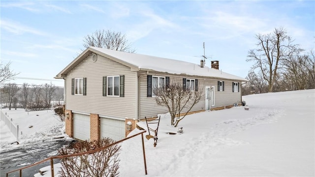 3240 E Lake Rd, Shenango, PA 16134 - ranch-style home featuring an attached garage, a chimney, and brick siding