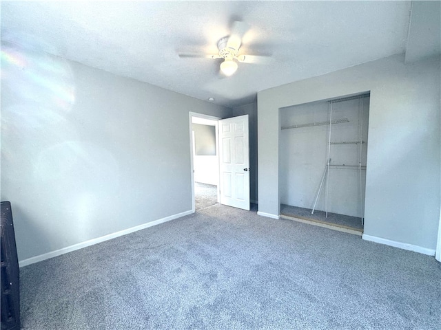 unfurnished bedroom with carpet flooring, ceiling fan, and a closet