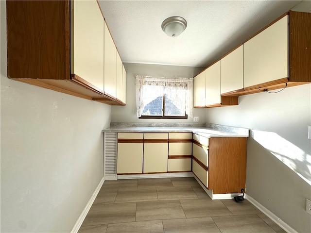 kitchen featuring a textured ceiling