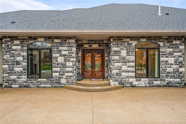 entrance to property featuring a patio area