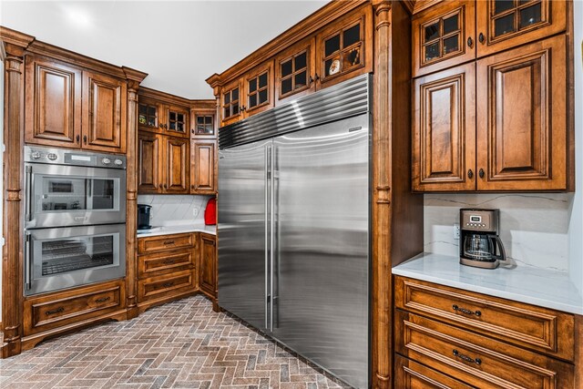 kitchen featuring backsplash and stainless steel appliances