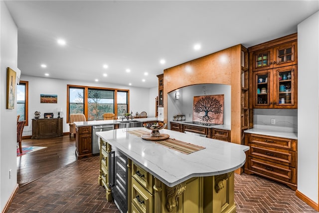 kitchen featuring green cabinets, wine cooler, stainless steel dishwasher, kitchen peninsula, and a kitchen island