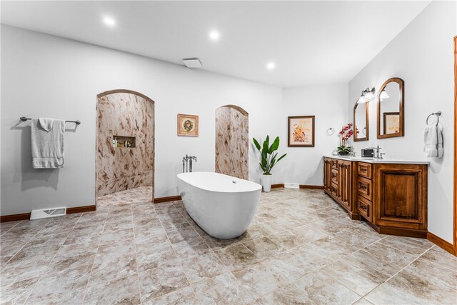 bathroom featuring a bathtub and vanity