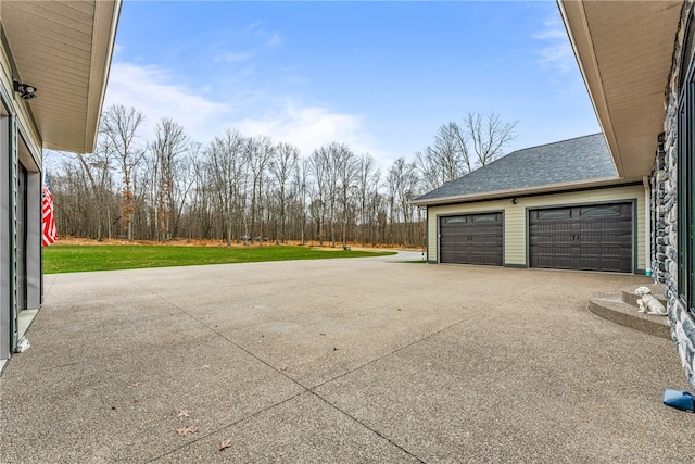 garage with a lawn