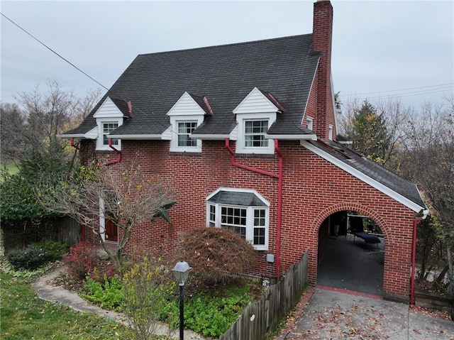 view of side of property with a carport