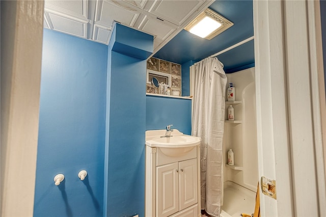 bathroom with vanity and curtained shower