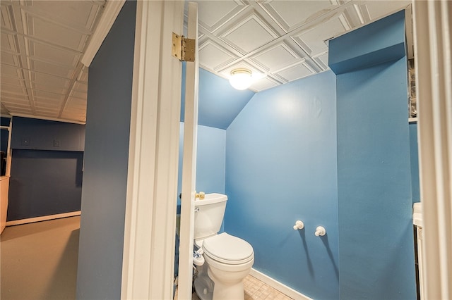 bathroom with tile patterned flooring and toilet