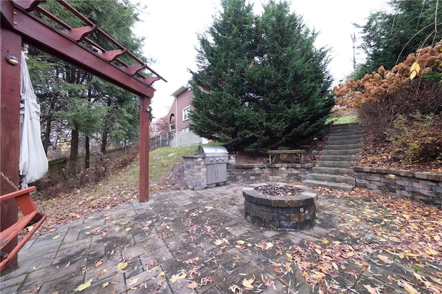 view of patio with a fire pit