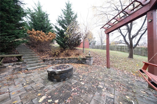 view of patio / terrace with an outdoor fire pit