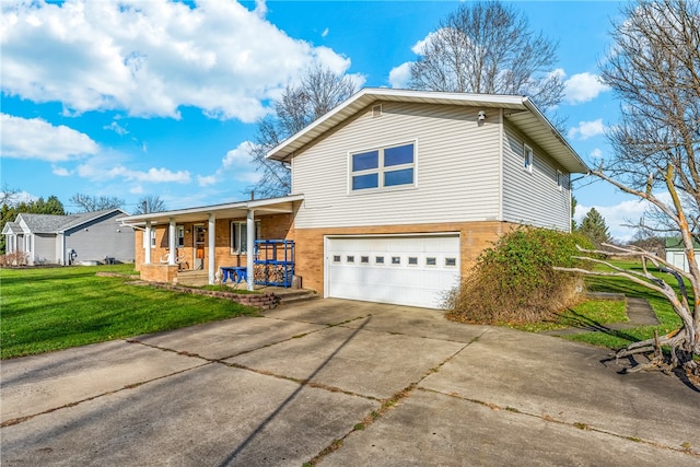 split level home featuring a porch, a garage, and a front lawn