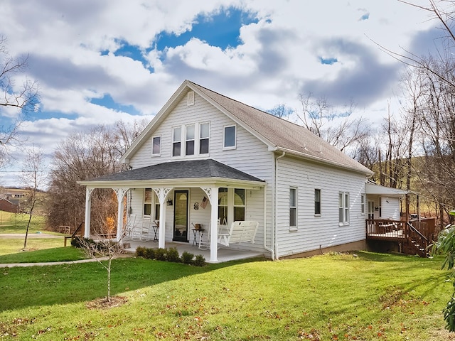 country-style home with a front lawn and a porch