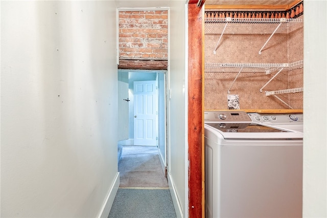 washroom with carpet flooring and washer / dryer