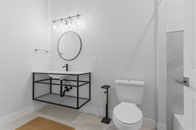 bathroom with tiled shower and toilet