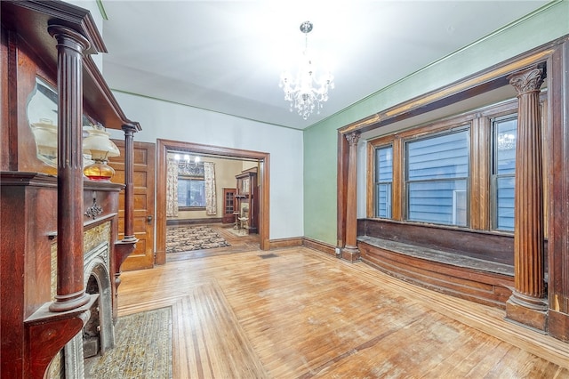 interior space with hardwood / wood-style floors and a chandelier