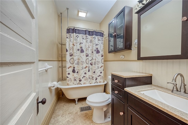 full bathroom featuring shower / bath combination with curtain, vanity, and toilet