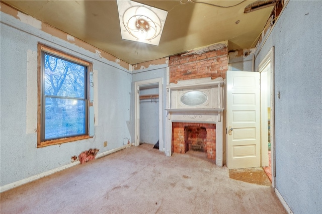 unfurnished living room featuring light colored carpet