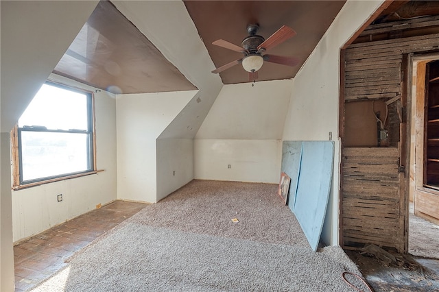 additional living space featuring ceiling fan and lofted ceiling