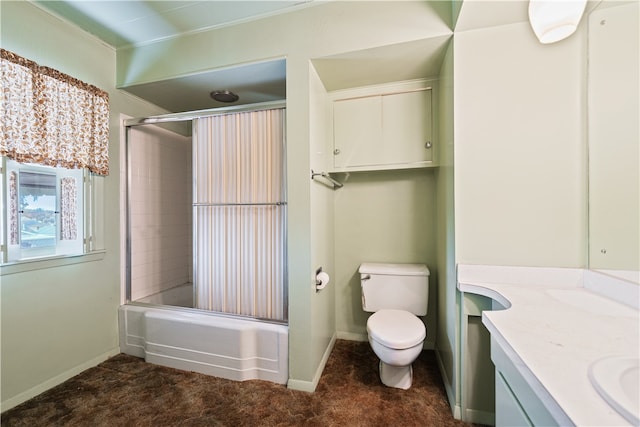 full bathroom with vanity, toilet, and combined bath / shower with glass door