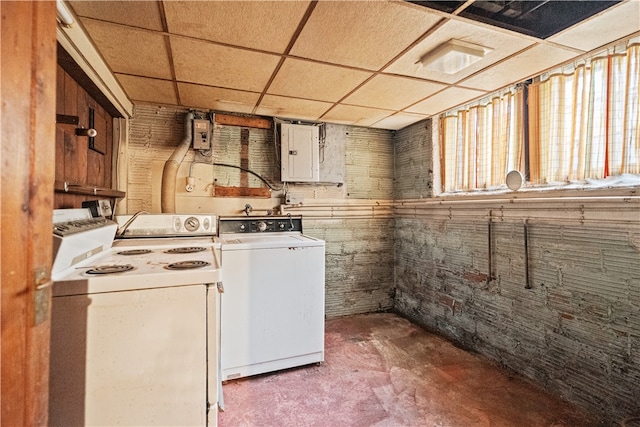 washroom with electric panel and washer / clothes dryer