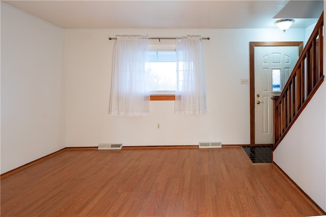 entryway with wood-type flooring