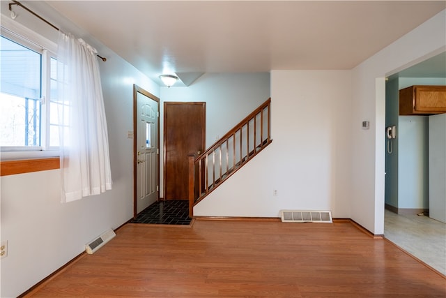 foyer entrance with light hardwood / wood-style flooring