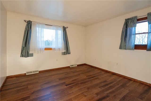 empty room featuring dark hardwood / wood-style floors