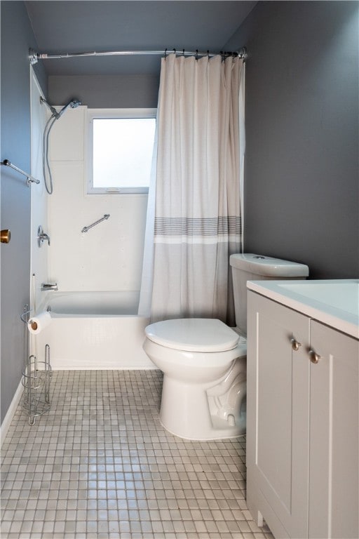 full bathroom with tile patterned flooring, vanity, toilet, and shower / tub combo