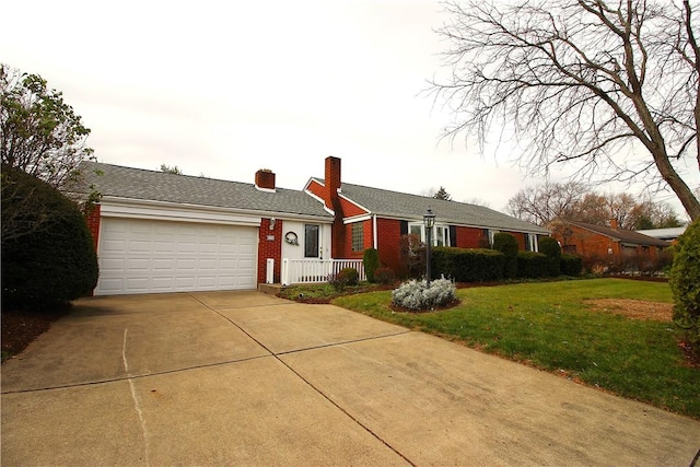 single story home featuring a garage and a front lawn