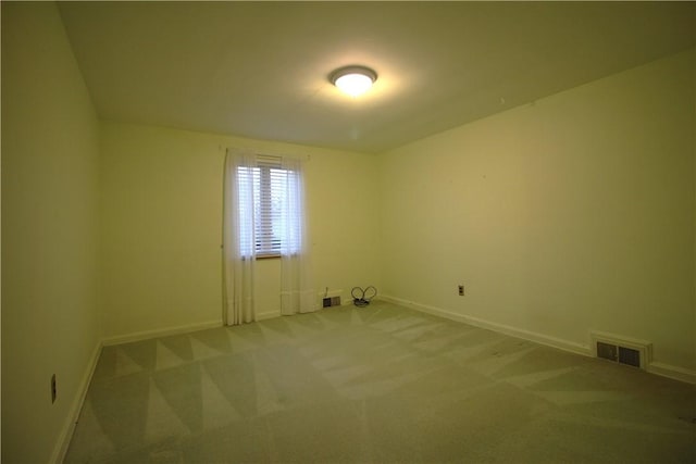 unfurnished room featuring carpet