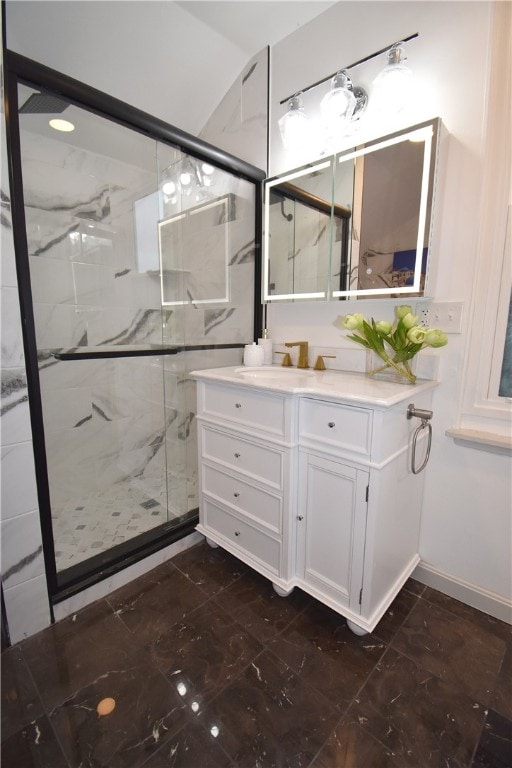 bathroom featuring vanity and an enclosed shower