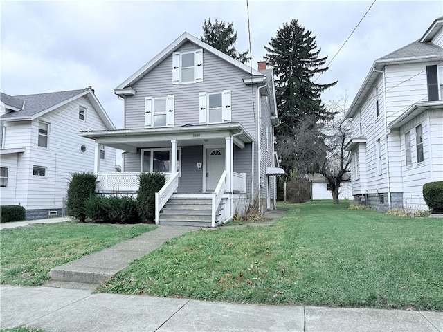 view of front facade with a porch and a front lawn