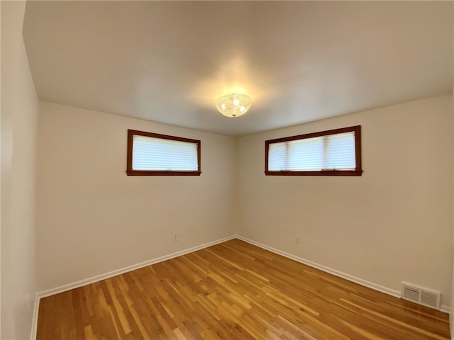 empty room featuring wood-type flooring