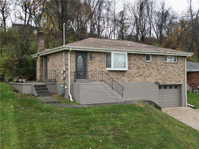 view of front of property with a garage and a front yard