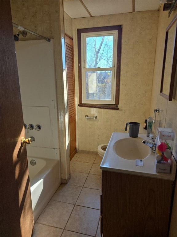 full bathroom with toilet, bathtub / shower combination, vanity, and tile patterned floors