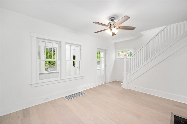 foyer featuring ceiling fan and light wood-type flooring