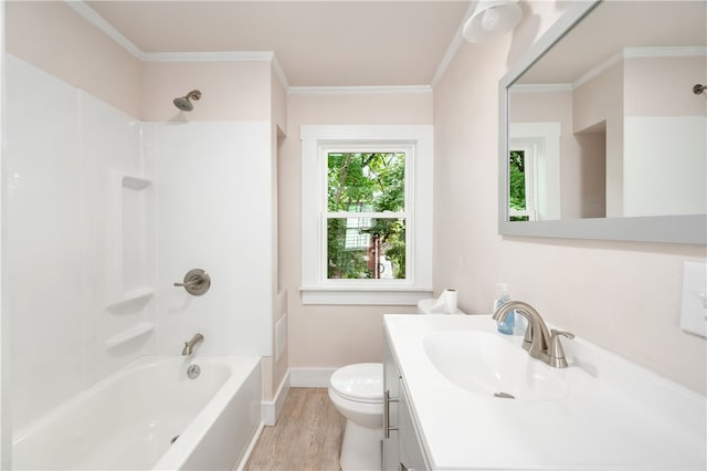 full bathroom featuring crown molding, hardwood / wood-style floors, shower / bathing tub combination, and toilet