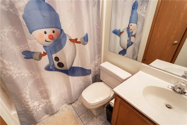 bathroom with tile patterned floors, vanity, and toilet