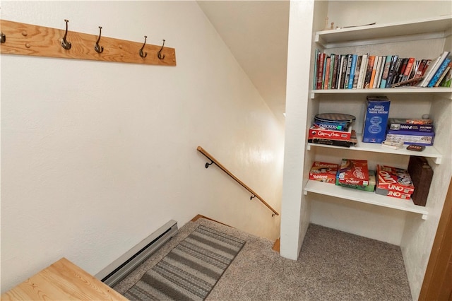 staircase featuring carpet flooring and a baseboard radiator