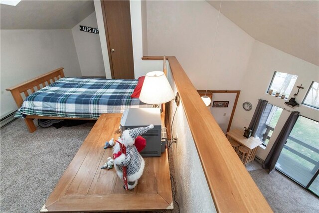 bedroom with carpet and high vaulted ceiling