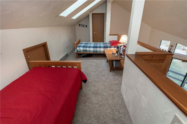 carpeted bedroom featuring lofted ceiling with skylight, a textured ceiling, and a baseboard heating unit