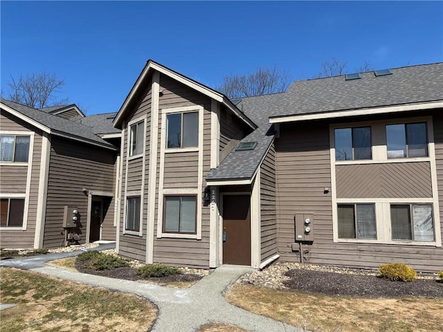 view of front of house with roof with shingles