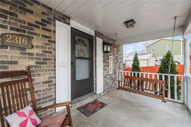 doorway to property with a porch