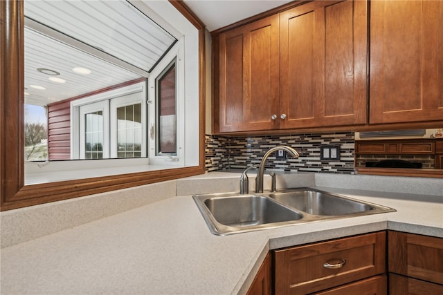 kitchen with backsplash and sink