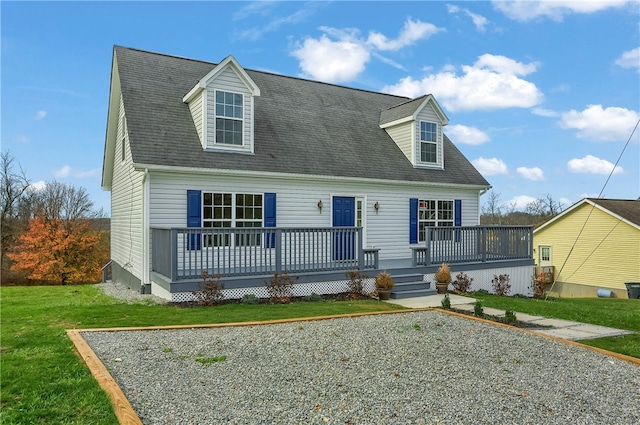 new england style home with a front yard