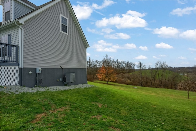 view of side of home with a lawn