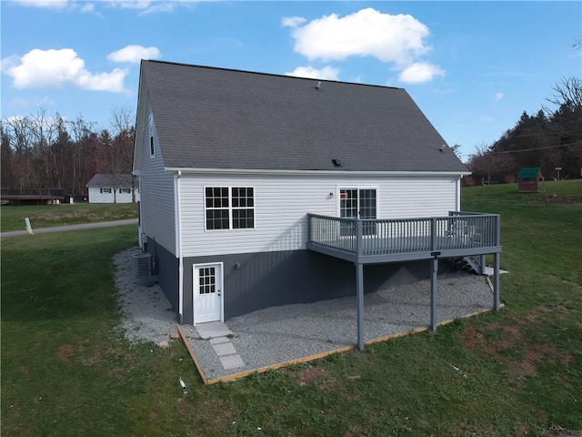 back of house with a yard, central AC unit, and a wooden deck