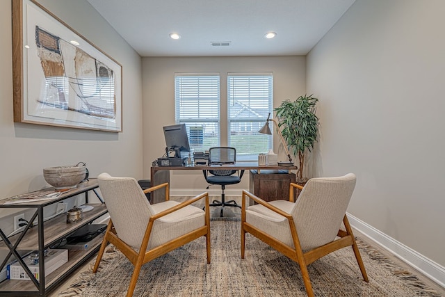 home office with hardwood / wood-style floors