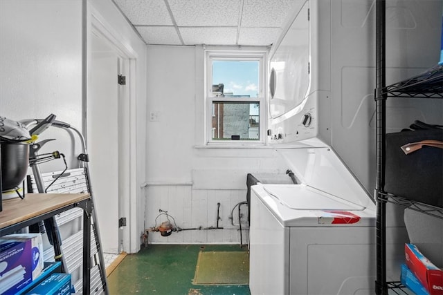 laundry area featuring stacked washer and dryer